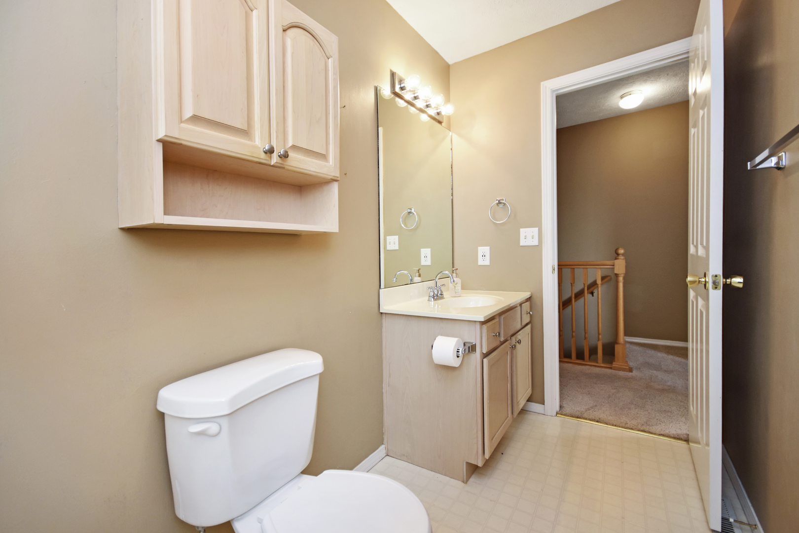 5 Andy Court, Unit 4 Bloomington, IL 61704 - Photo 33 of 52 a bathroom with a toilet sink and mirror
