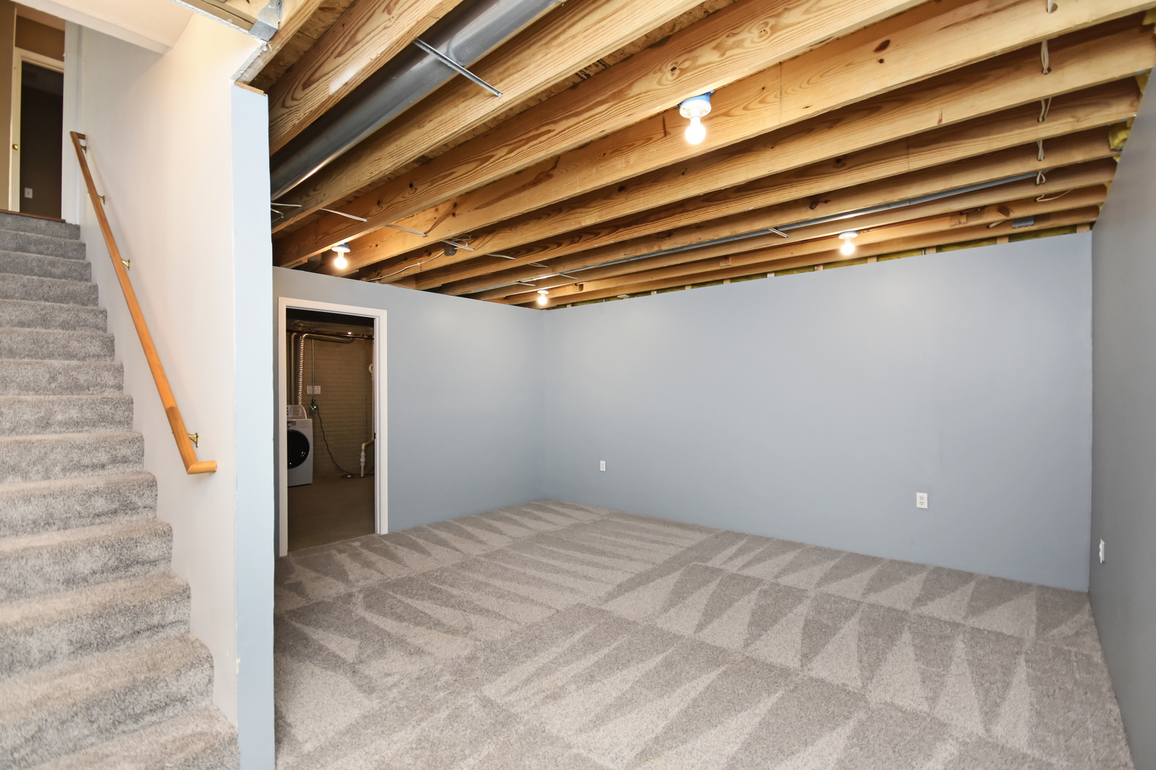 5 Andy Court, Unit 4 Bloomington, IL 61704 - Photo 36 of 52 a view of a room with stairs and a ceiling fan
