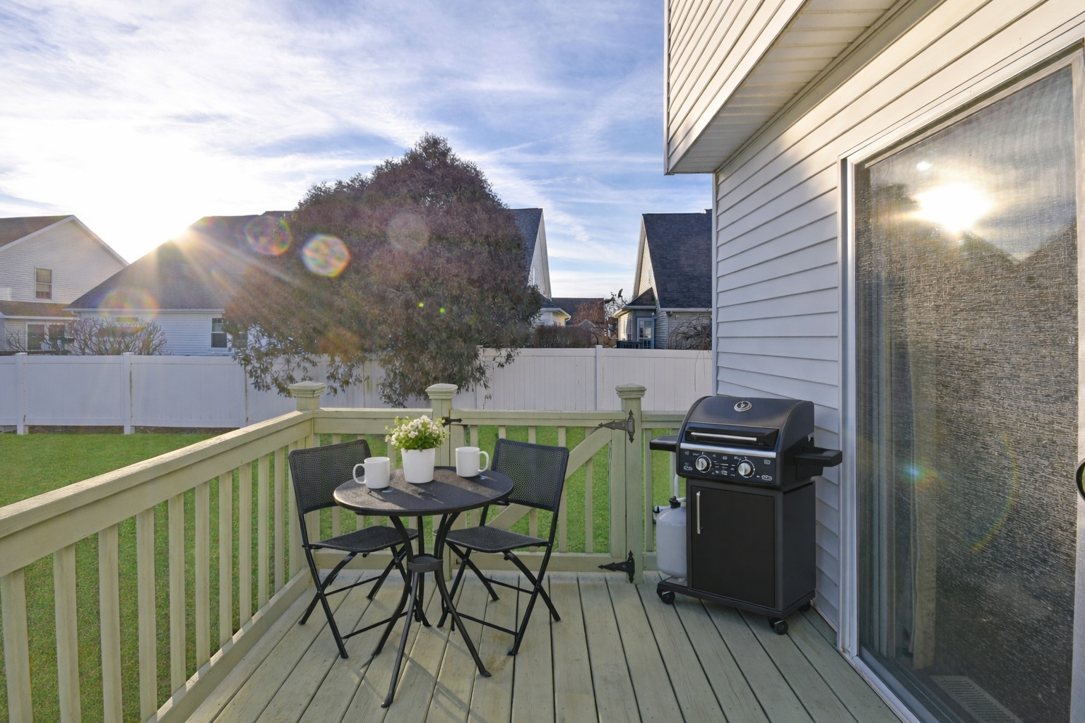 5 Andy Court, Unit 4 Bloomington, IL 61704 - Photo 44 of 52 a balcony with table and chairs
