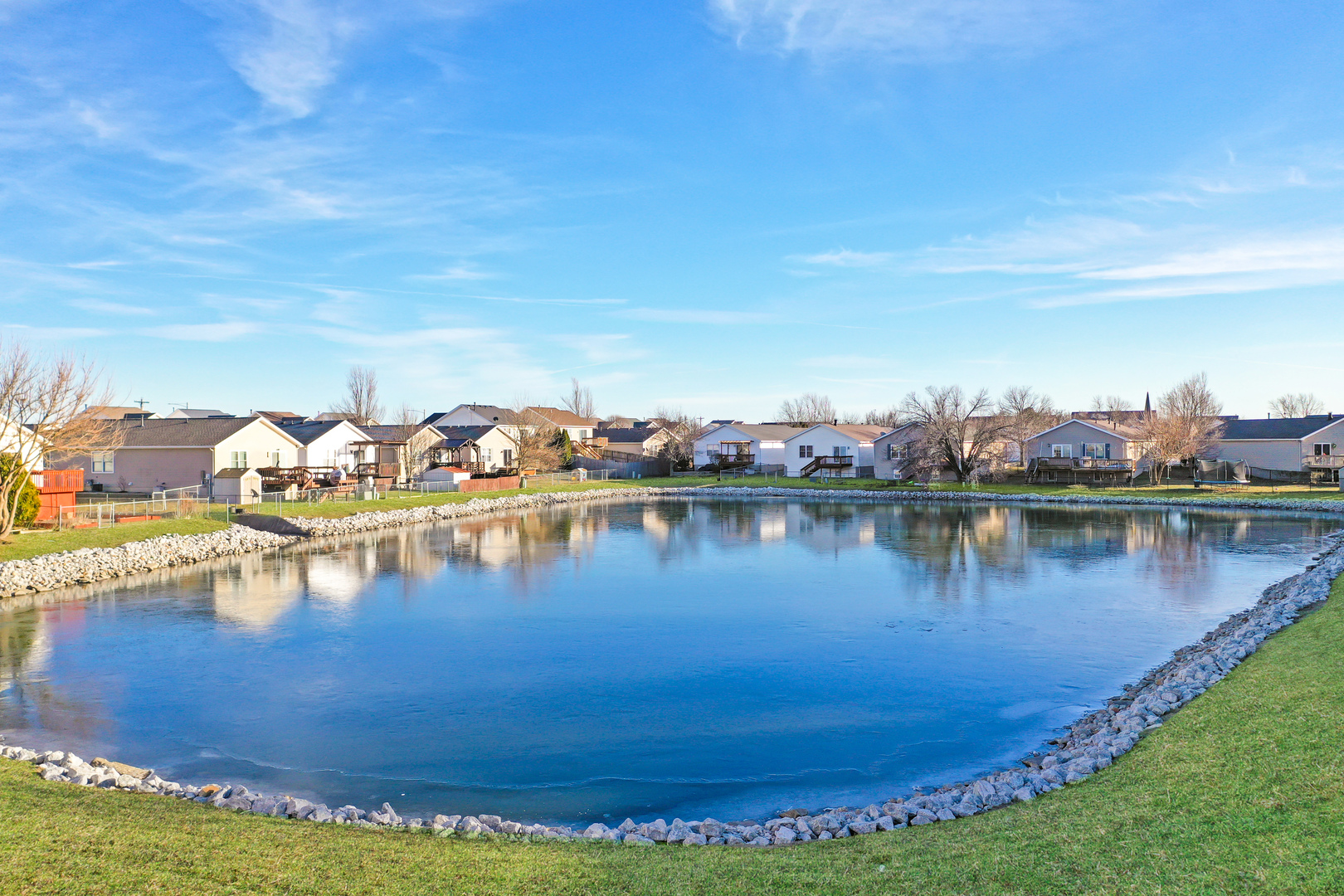 5 Andy Court, Unit 4 Bloomington, IL 61704 - Photo 47 of 52 a view of a lake with an outdoor space