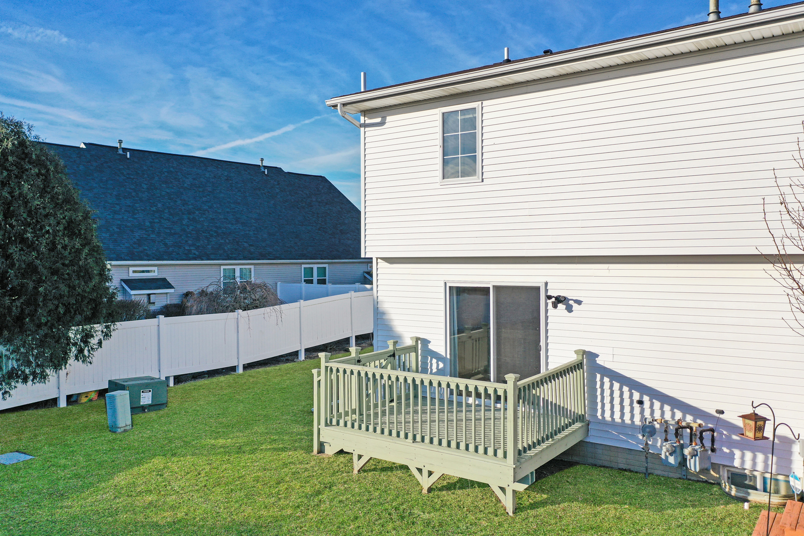 5 Andy Court, Unit 4 Bloomington, IL 61704 - Photo 50 of 52 a view of a house with a yard and deck