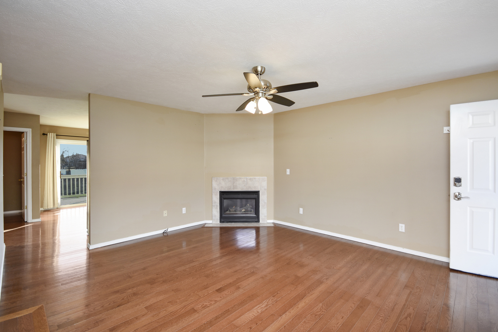 5 Andy Court, Unit 4 Bloomington, IL 61704 - Photo 5 of 52 a view of an empty room with wooden floor