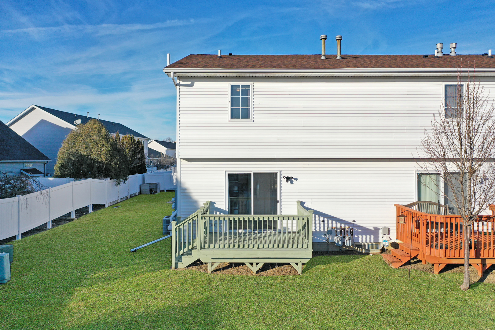 5 Andy Court, Unit 4 Bloomington, IL 61704 - Photo 51 of 52 a view of a chair and table in backyard of the house