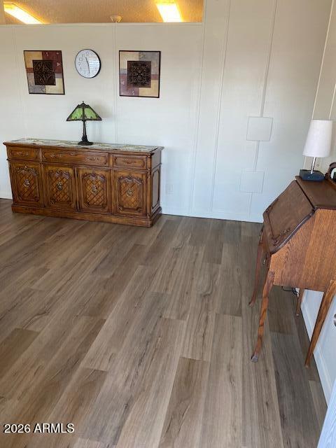 301 South Signal Butte Road, Unit 1124 Apache Junction, AZ 85120 - Photo 4 of 41 a spacious bedroom with a bed and wooden floor