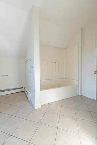 a view of a utility room with closet