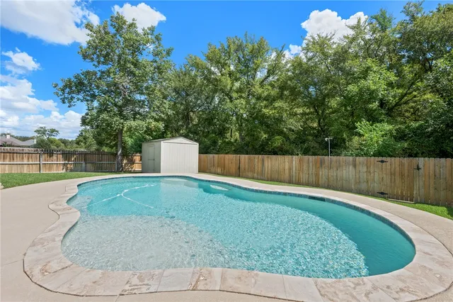 a view of a backyard with a small cabin