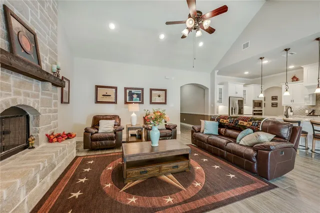 a living room with furniture fireplace and a fireplace