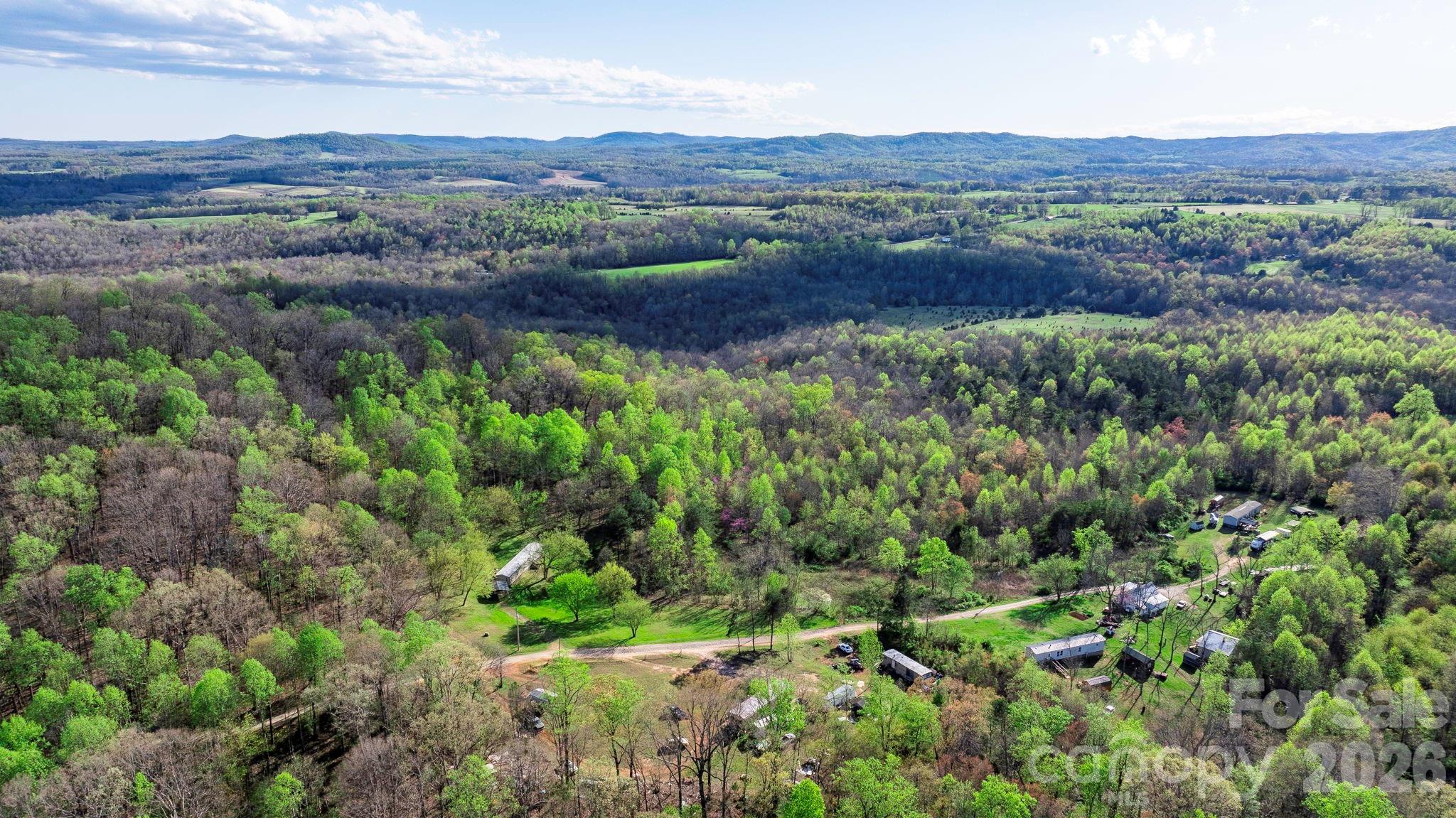 0 Somers Road North Wilkesboro, NC 28659 - Photo 13 of 24 a view of a lush green field with lots of bushes