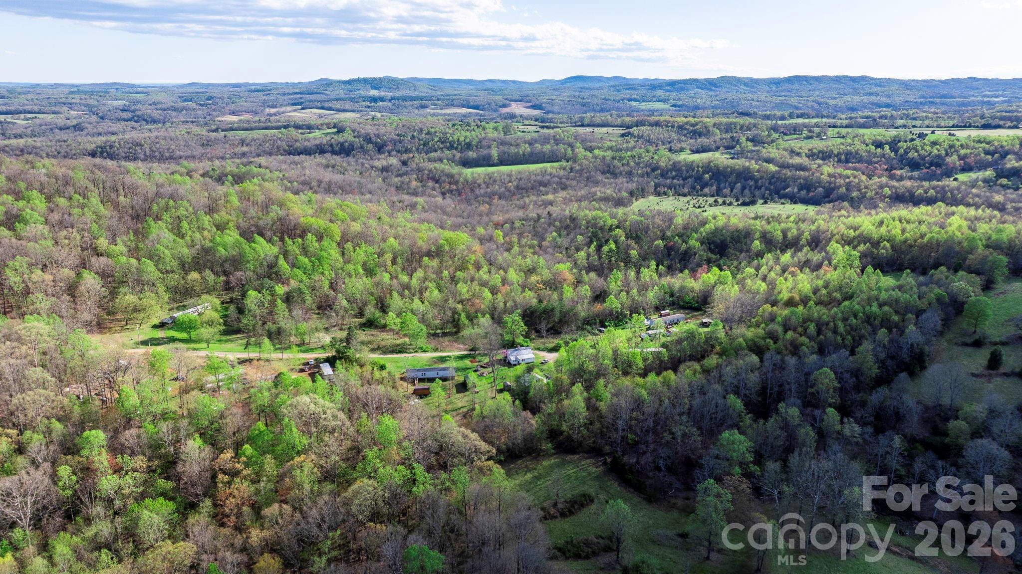 0 Somers Road North Wilkesboro, NC 28659 - Photo 20 of 24 a view of a lush green hillside and houses