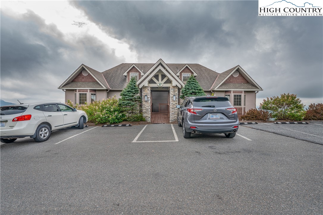 299 Trails End Extension, Unit 37C Sugar Mountain, NC 28604 - Photo 19 of 38 a view of front a house with a garden and parking space