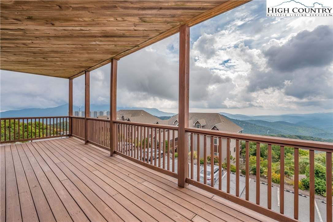 299 Trails End Extension, Unit 37C Sugar Mountain, NC 28604 - Photo 2 of 38 a view of a wooden balcony with wooden floor