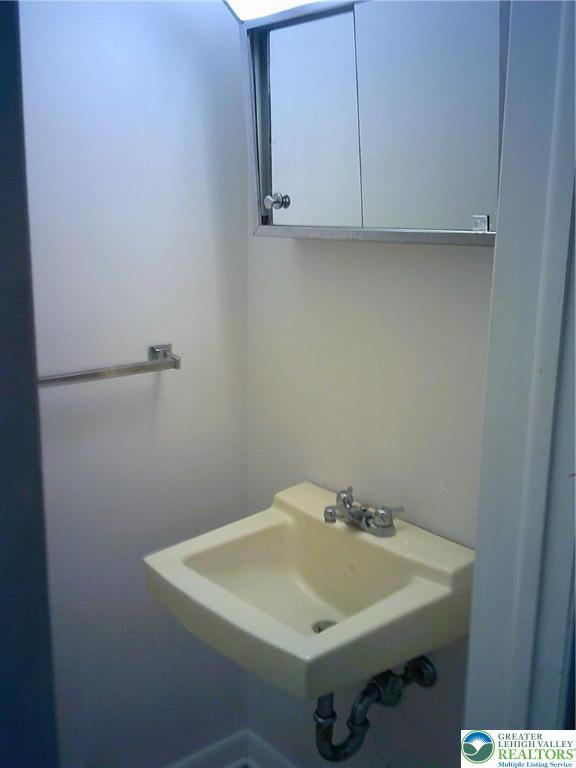 2041 Grove Street Allentown, PA 18104 - Photo 10 of 23 1st floor powder room sink & medicine cabinet