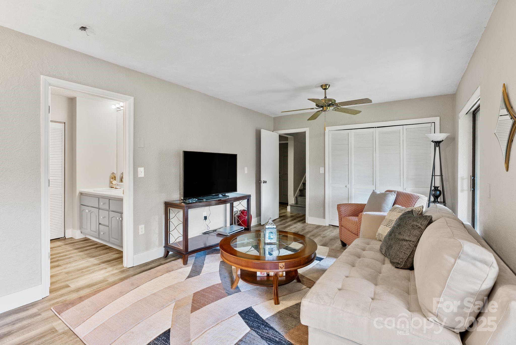 386 Country Club Drive Canton, NC 28716 - Photo 27 of 47 a living room with furniture and a flat screen tv