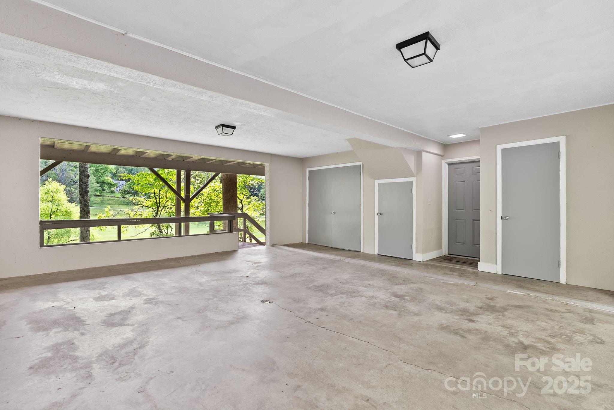 386 Country Club Drive Canton, NC 28716 - Photo 30 of 47 a view of an empty room with a window