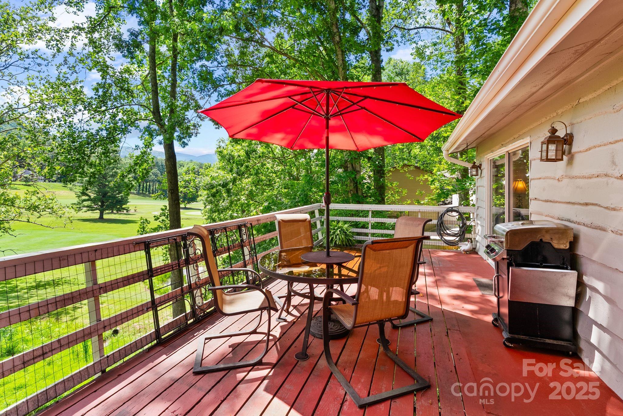 386 Country Club Drive Canton, NC 28716 - Photo 35 of 47 an outdoor space with furniture and umbrella