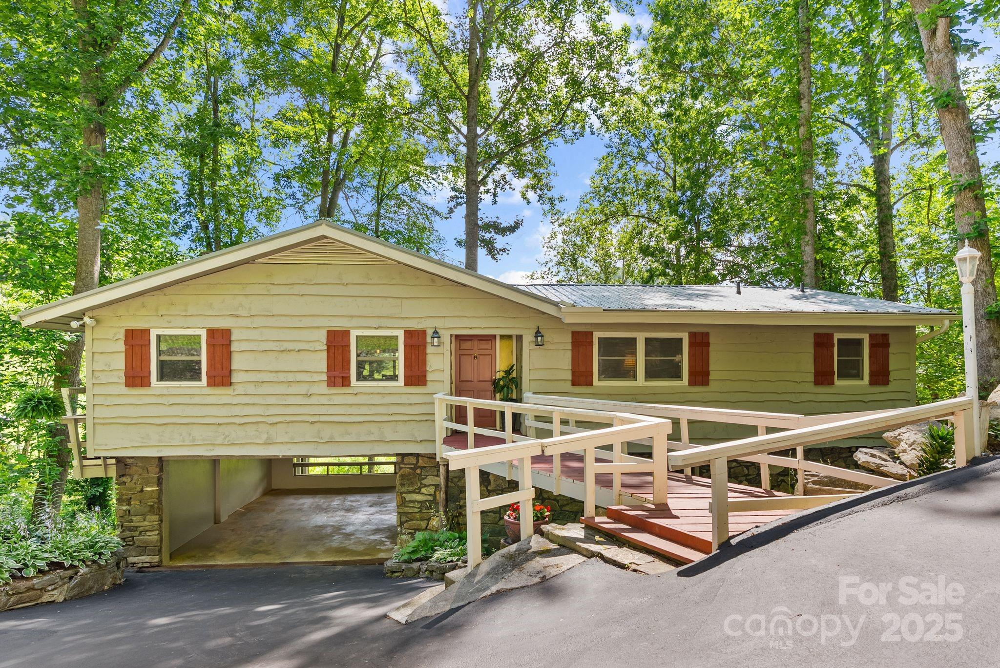 386 Country Club Drive Canton, NC 28716 - Photo 43 of 47 a front view of a house with yard