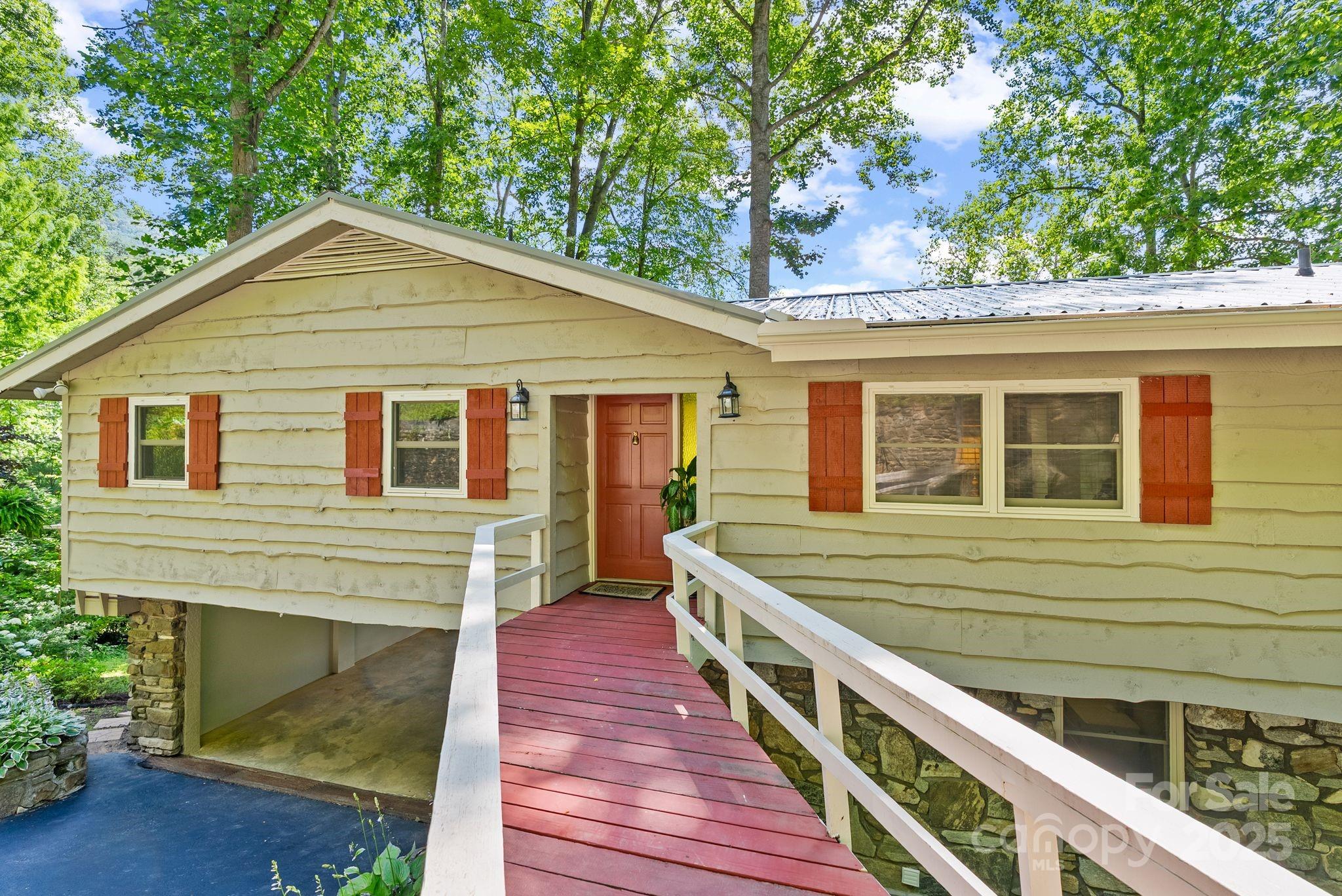 386 Country Club Drive Canton, NC 28716 - Photo 44 of 47 a front view of a house with a yard