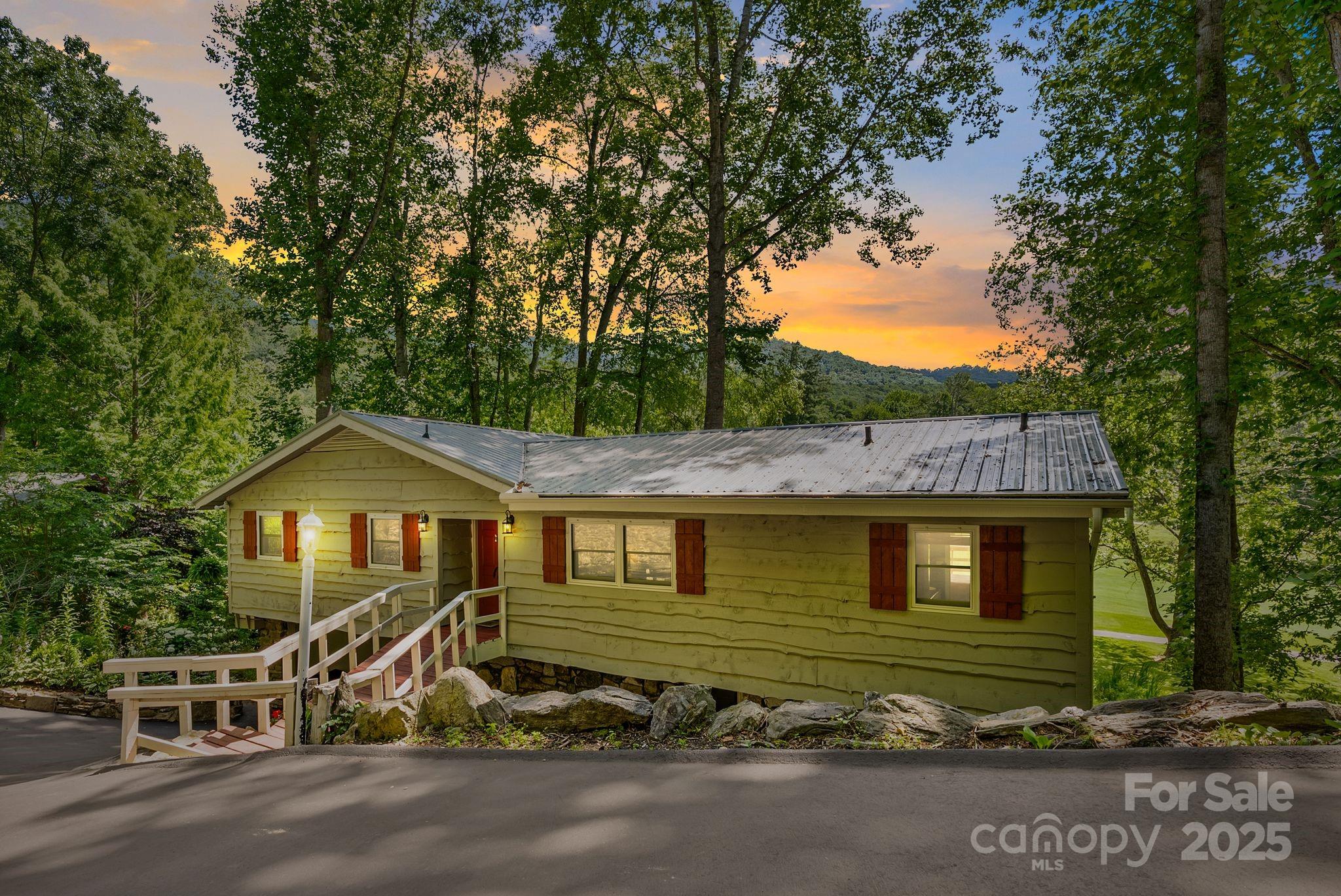 386 Country Club Drive Canton, NC 28716 - Photo 5 of 47 a front view of a house with a yard