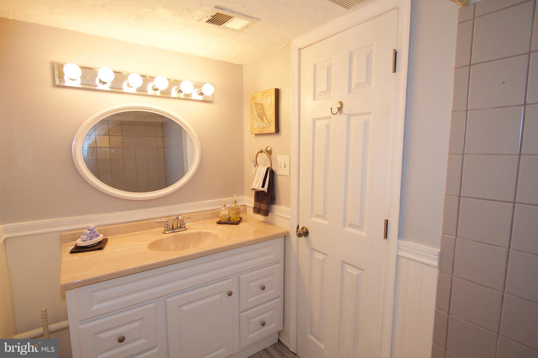 2507 Baltimore Road, Unit 1 Rockville, MD 20853 - Photo 14 of 30 a bathroom with a sink and a mirror