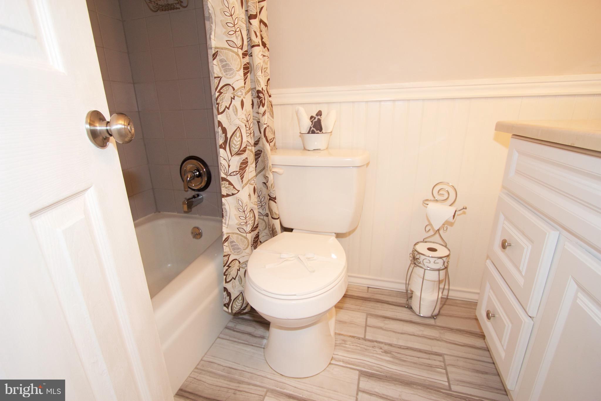2507 Baltimore Road, Unit 1 Rockville, MD 20853 - Photo 16 of 30 a bathroom with a toilet and a shower