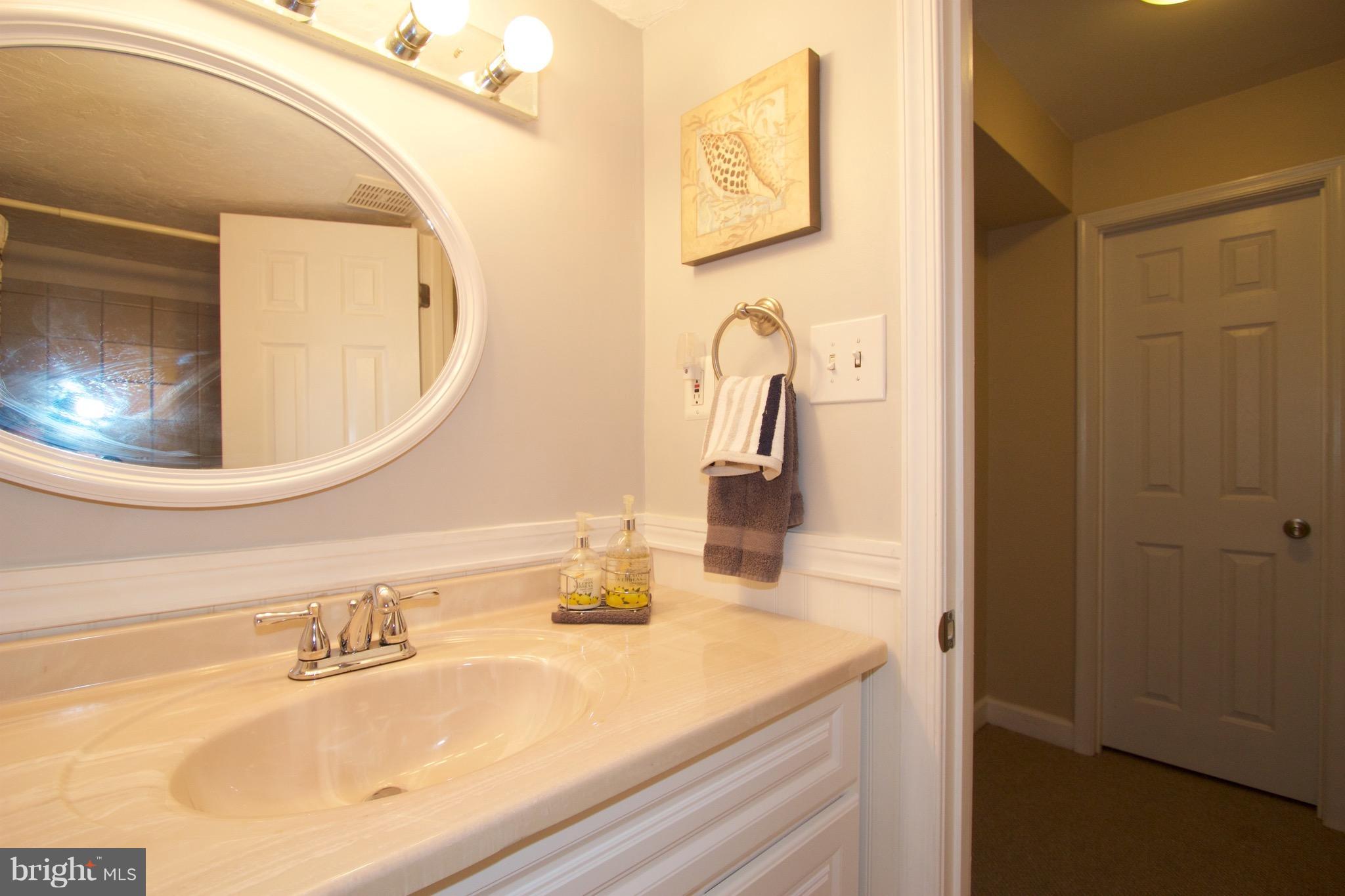 2507 Baltimore Road, Unit 1 Rockville, MD 20853 - Photo 17 of 30 a bathroom with a sink and a mirror