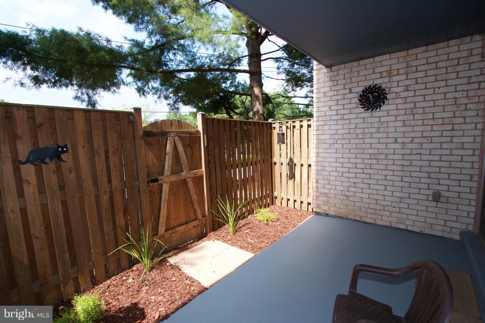 2507 Baltimore Road, Unit 1 Rockville, MD 20853 - Photo 21 of 30 a view of a porch with a bench