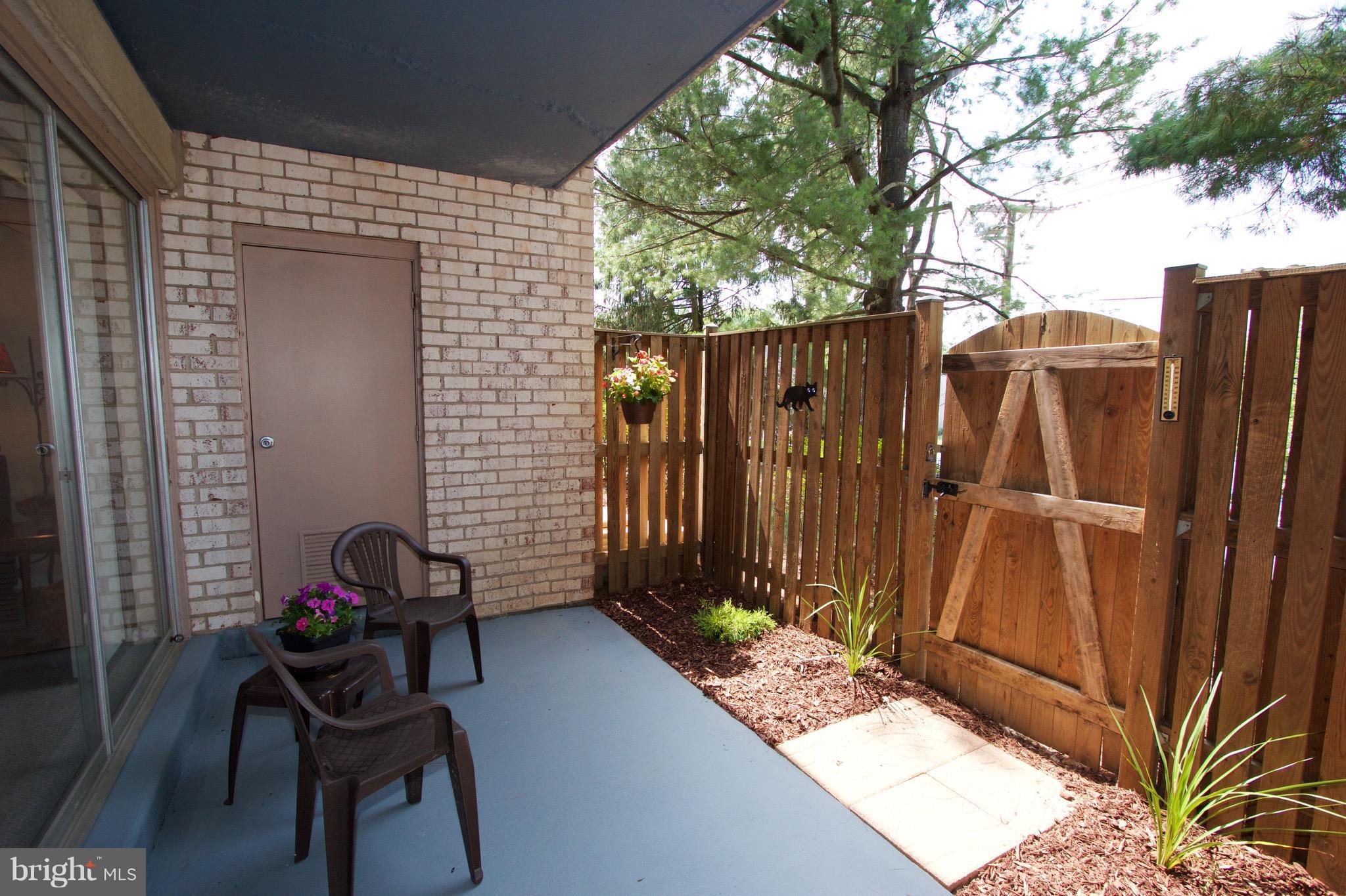 2507 Baltimore Road, Unit 1 Rockville, MD 20853 - Photo 22 of 30 a view of backyard with barbeque grill and wooden fence