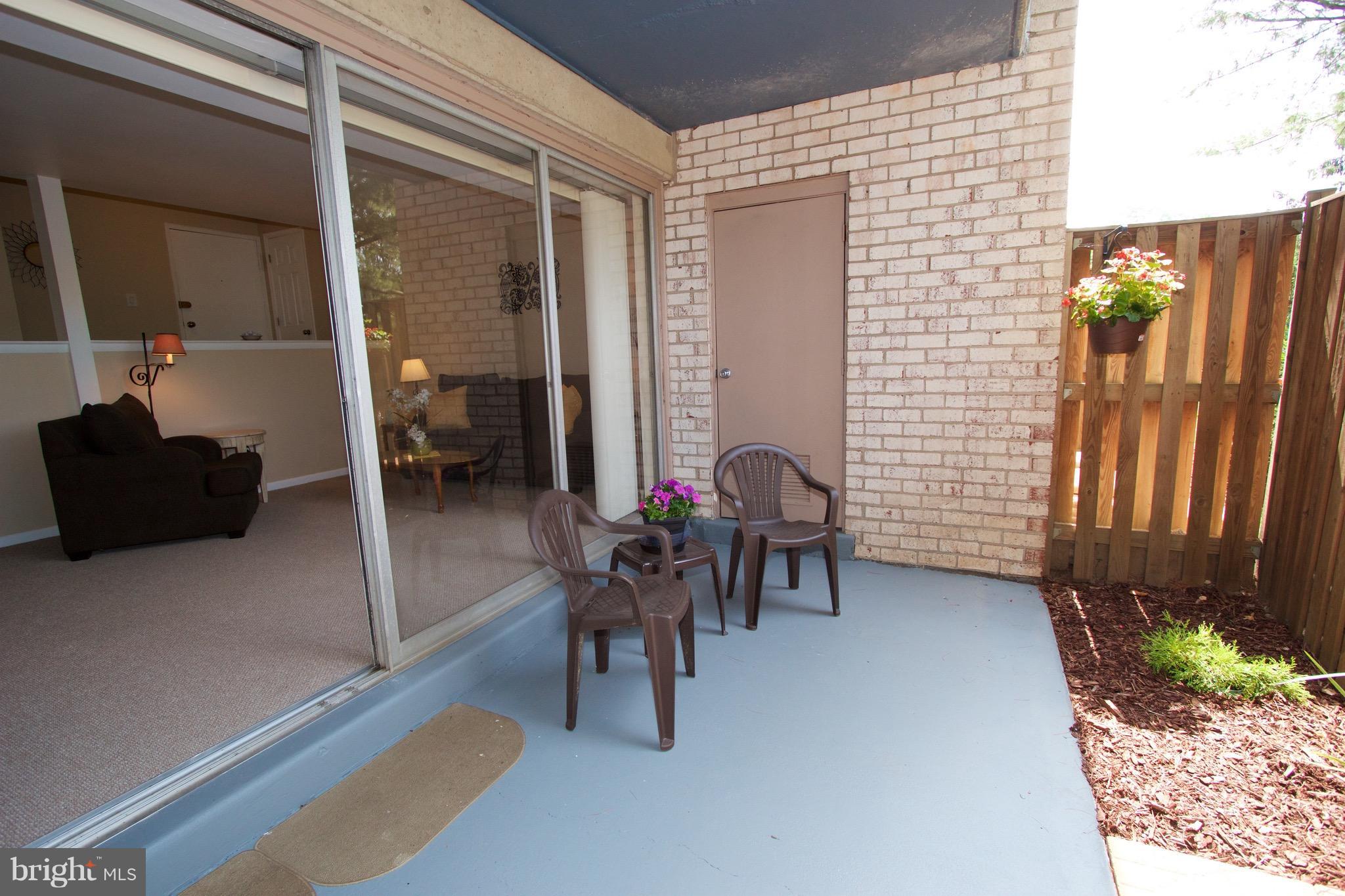 2507 Baltimore Road, Unit 1 Rockville, MD 20853 - Photo 23 of 30 a view of a patio with table and chairs