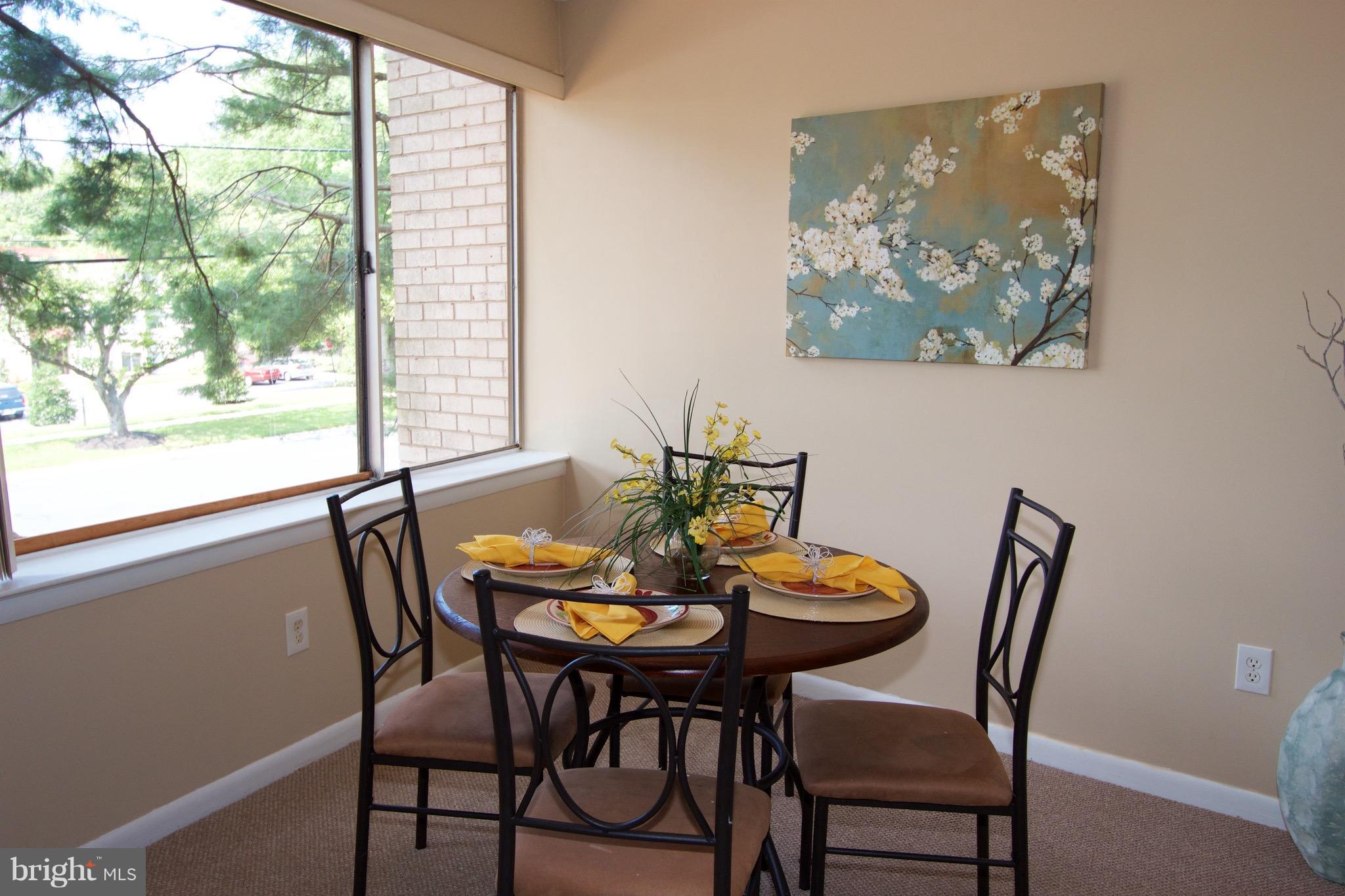 2507 Baltimore Road, Unit 1 Rockville, MD 20853 - Photo 8 of 30 a view of a dining room with furniture window and outside view