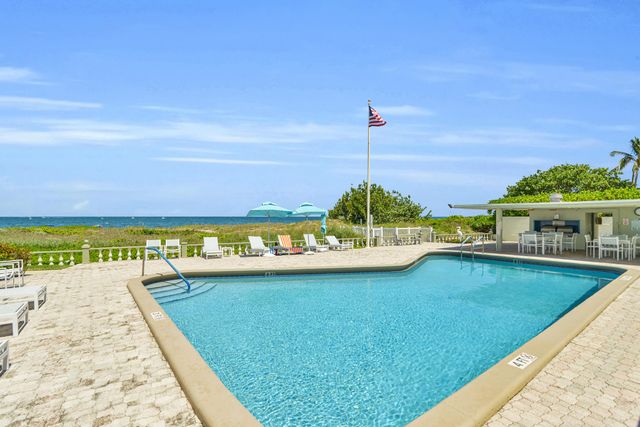 a view of balcony with wooden floor and fence
