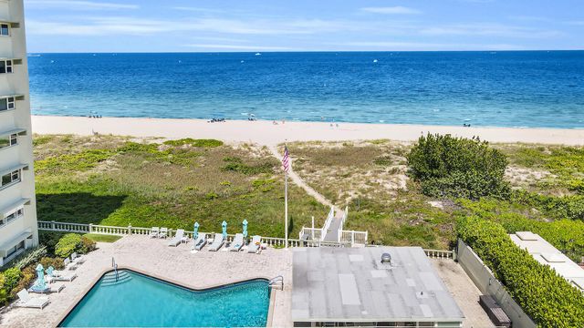 a view of a big yard with table and chairs