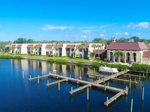 a view of houses with outdoor space and lake view