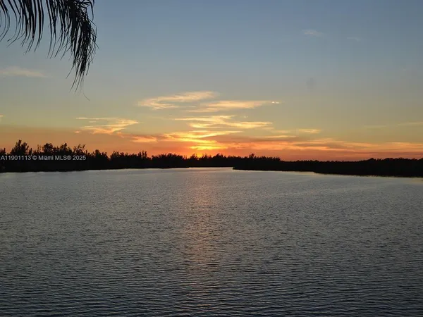 a view of lake and sunset