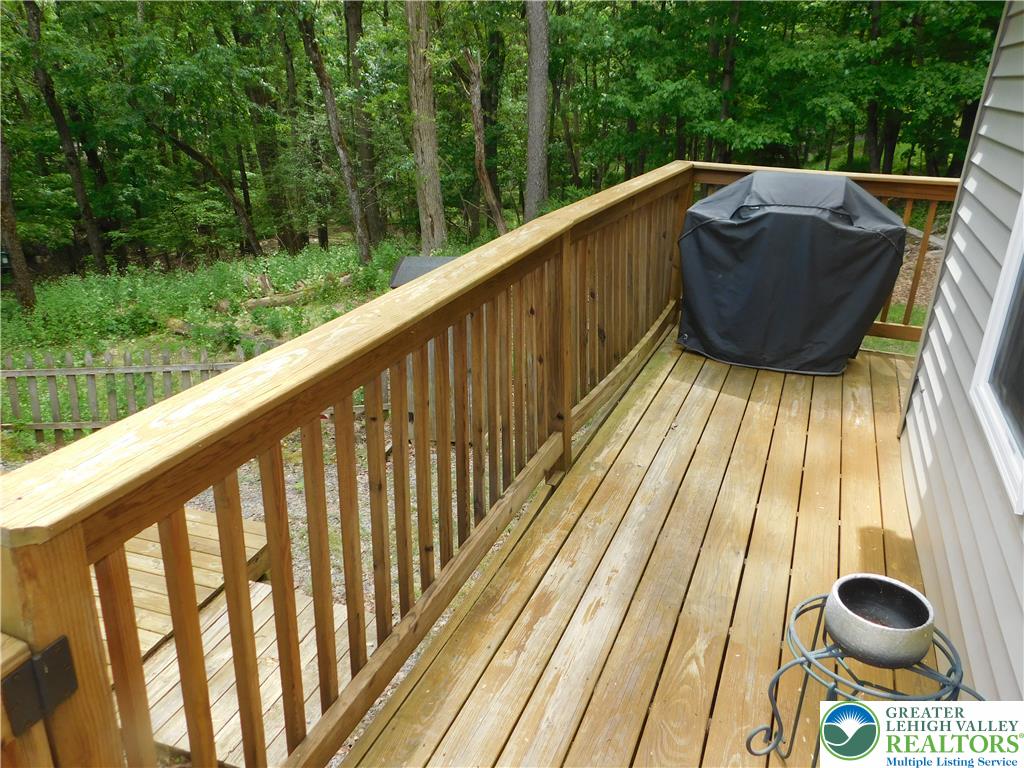 41 Reeder Street Mount Pocono, PA 18344 - Photo 12 of 41 A spacious wooden deck provides ample outdoor living space, perfect for entertaining.