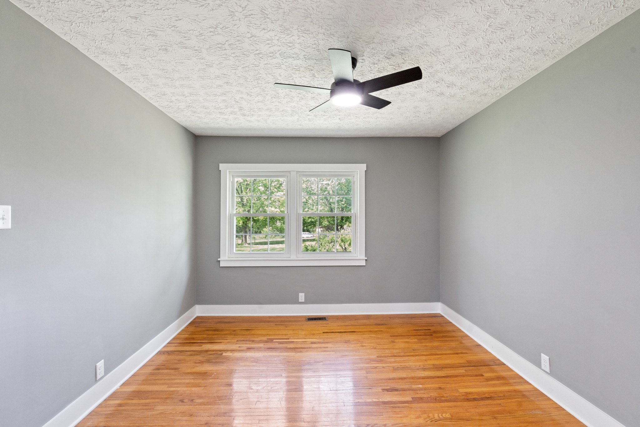 1503 5th Avenue West Springfield, TN 37172 - Photo 22 of 43 a view of a room with window ceiling fan and wooden floor