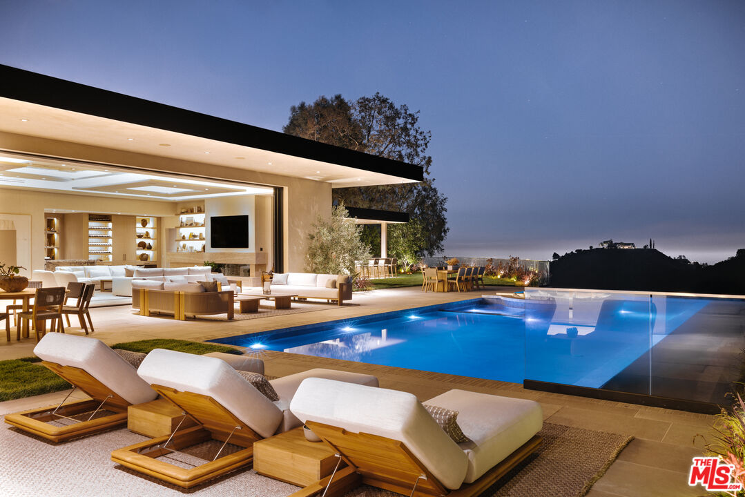 a view of a patio with swimming pool table and chairs