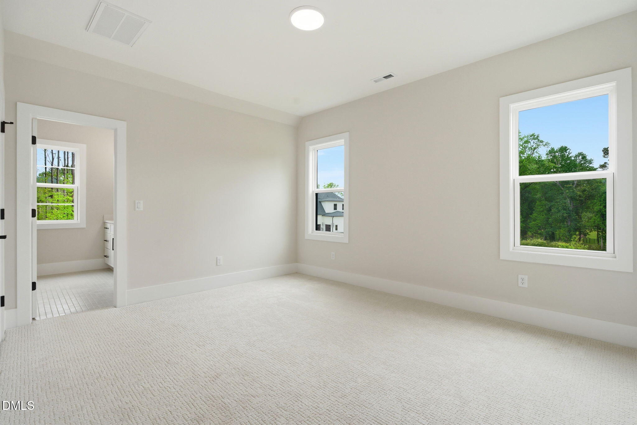 1304 Sanctuary Pond Drive Raleigh, NC 27606 - Photo 35 of 52 an empty room with windows
