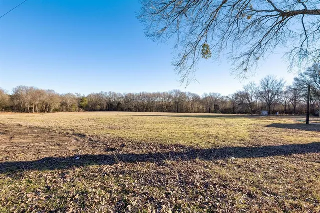 a view of a lake with a yard