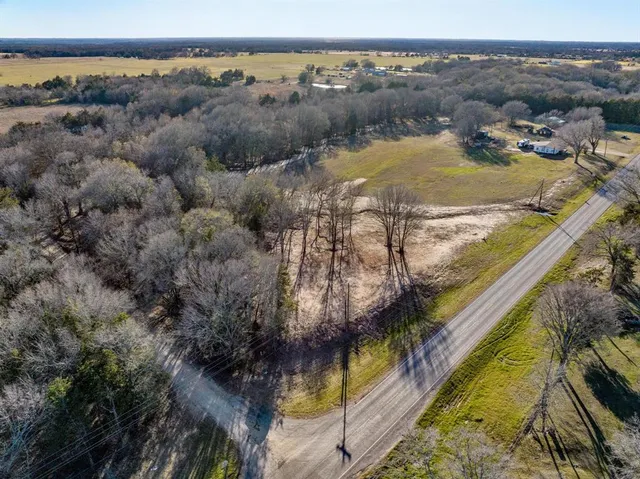 a view of outdoor space with deck and trees