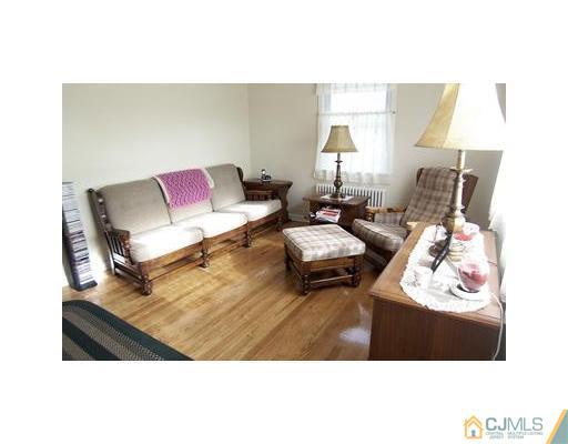 38 Lancaster Road Colonia, NJ 07067 - Photo 2 of 14 a living room with furniture