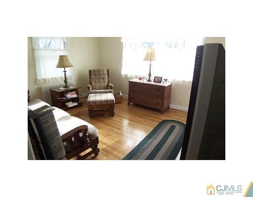 38 Lancaster Road Colonia, NJ 07067 - Photo 3 of 14 a living room with furniture