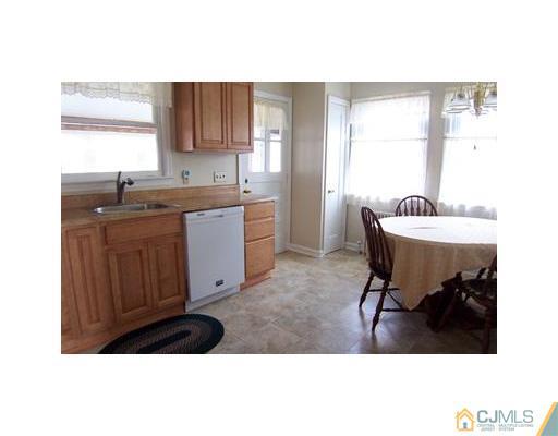 38 Lancaster Road Colonia, NJ 07067 - Photo 4 of 14 a kitchen with a sink cabinets and window