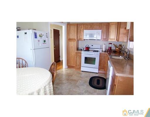 38 Lancaster Road Colonia, NJ 07067 - Photo 5 of 14 a kitchen with a washer and dryer