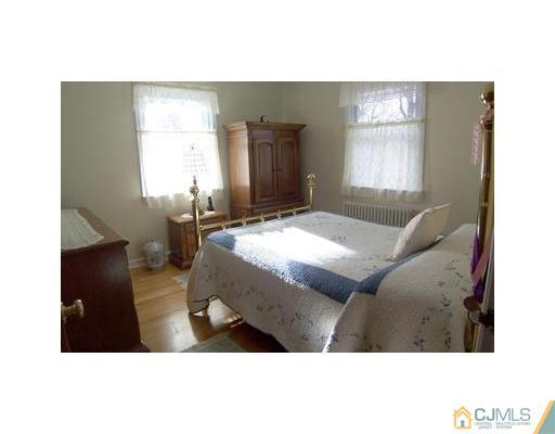 38 Lancaster Road Colonia, NJ 07067 - Photo 7 of 14 a living room with furniture and a window