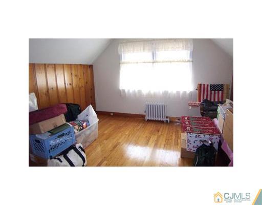38 Lancaster Road Colonia, NJ 07067 - Photo 10 of 14 a view of an entryway with wooden floor