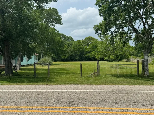 a dining room with wooden floor outdoor seating and dining space