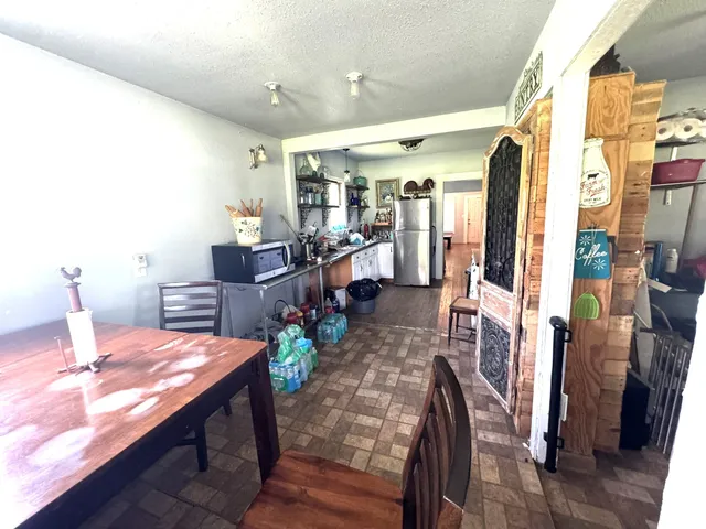 a large kitchen with lots of counter space and stainless steel appliances