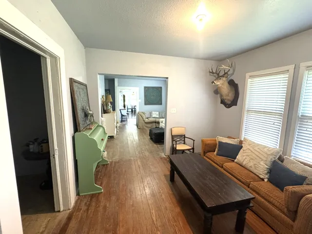 a bedroom with bed and a mirror