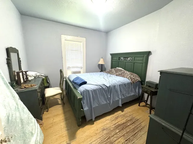 a view of a room with furniture and window