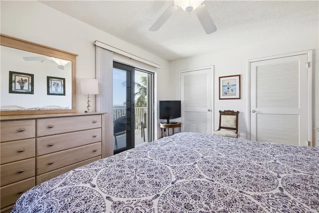 a bed room with a bed and a television